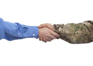 Veteran and civilian clasp hand